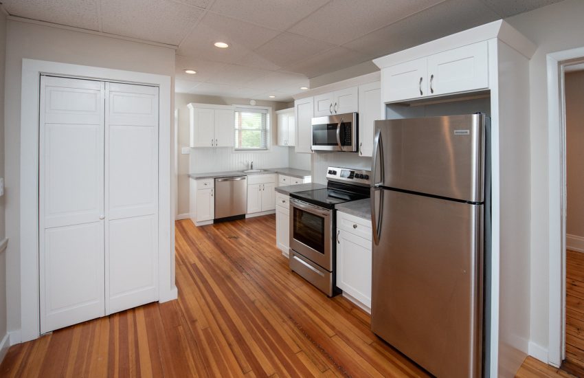 Interior view of the renovated 2-bedroom rental apartment at 19 Warsaw Ave in Mechanicville, NY located in a historic building with modern finishes.